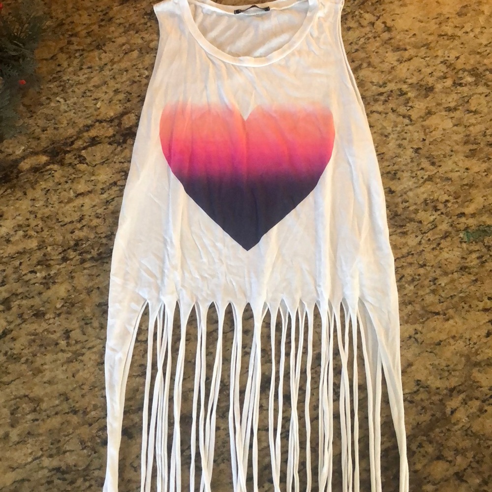 White shirt with a rainbow heart and loose twists.